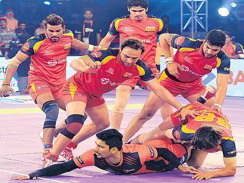 I MADE IT! U Mumba's Rishank Devadiga successfully completes a raid, thwarting Bengaluru Bulls' players in the Pro Kabaddi League on Wednesday. DH PHOTO/ Srikanta Sharma R