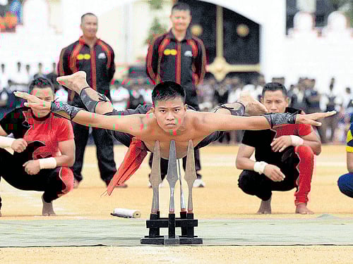 Corps of the Assam Regiment Centre present the Northeast Warriors Display during the rehearsal for the Independence Day celebrations at Field Marshal Manekshaw Parade Grounds on Thursday. DH photo