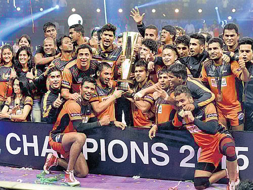 champions: U Mumba players strike a pose after winning the second edition of the Pro Kabaddi League on Sunday. PTI