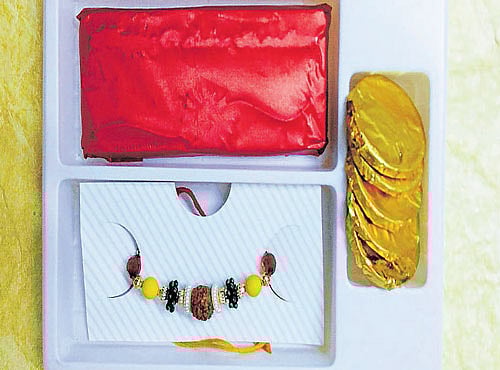 SWEET SOMETHING A chocolate box with a 'rakhi'.