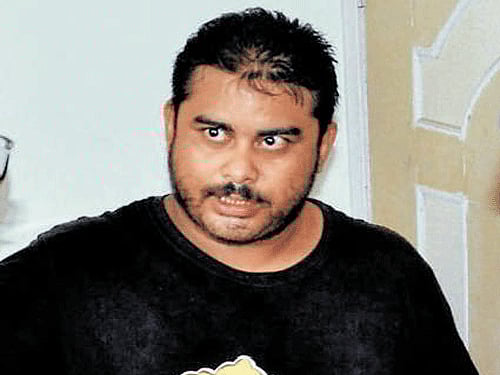 Mikhail Bora, son of Indrani Mukerjea, speaks to an investigating officer in Guwahati on Thursday. PTI