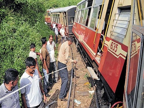 tragedy on tracks: People gather at the site of the derailment of a chartered narrow gauge train at Parwanoo on the Kalka-Shimla Unesco Heritage Track on Saturday. AFP