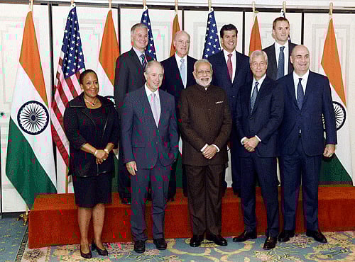 Prime Minister Narendra Modi poses before a meeting with officials of top Financial institutions in New York on Thursday. PTI Photo