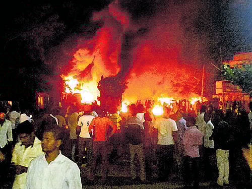 Shops in flames after arsonists set them afire. DH photo