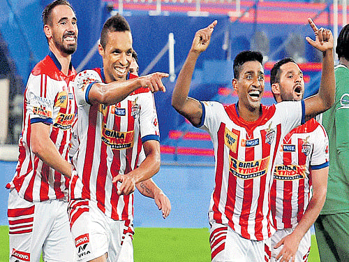 JOYOUSBUNCH: Atletico de Kolkata players celebrate after winning the opening gameof the second Indian Super League against Chennaiyin FC. PTI