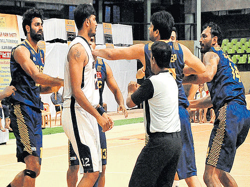 tense affair Income Tax and ONGC players scuffle during their final match on Sunday. DH Photo.