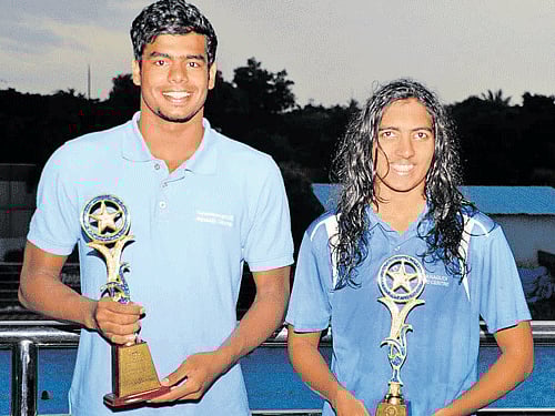 all smiles BAC's Arvind M (left)) and Malavika V pose with their best swimmer spoils on Sunday. DH Photo