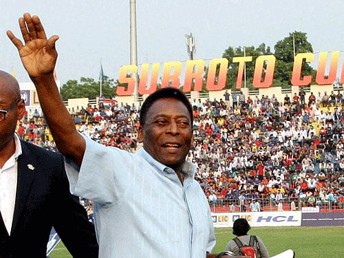 Brazilian football legend Pele waves to his fans before the start of the Under-17 boys final match of the Subroto Cup as Chief Guest at the Ambedkar Stadium in New Delhi on Friday. PTI Photo.