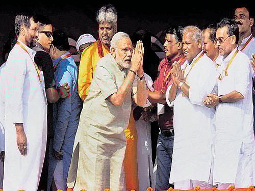 Rally around: Narendra Modi with Ram Vilas Paswan, Jitan Ram Manjhi and Upendra Kushwaha at an election rally in Hajipur on Sunday. PTI