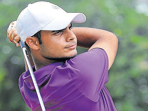 POWERING AHEAD Shubhankar Sharma in action in the second round of the India Masters at the Eagleton on Thursday. DH PHOTO/ SRIKANTA SHARMA R