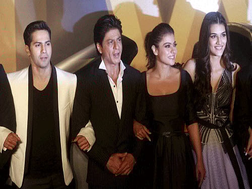 Bollywood actors Varun Dhawan, left, Shah Rukh Khan, Kajol and Kriti Sanon pose for photographs during the trailer launch of 'Dilwale', in Mumbai on Monday. The movie is scheduled to release on Dec. 18. PTI Photo.