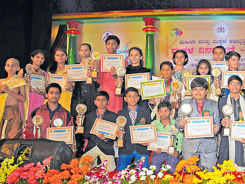 Young achievers with their trophies and certificates at the Children's Day function at Bal Bhavan on Saturday.DH PHOTO