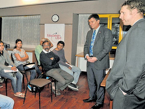 Charles E Luoma-Overstreet, Chief of the Consular Section, US Consulate General, Chennai, and Vice Consular Brock D Fox interact with students and parents at the 'Study in the US' event in the City on Thursday. dh photo