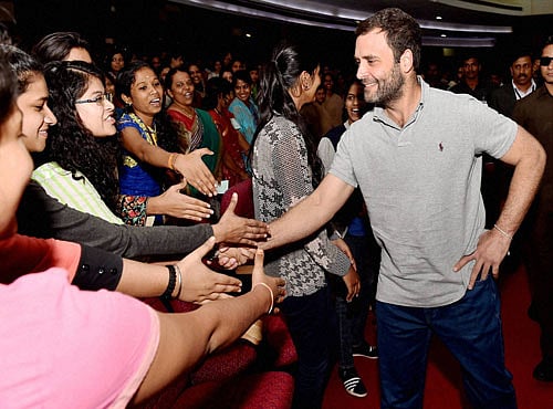 Congress Vice President Rahul Gandhi greet students on his arrival at a interactive session with students of Mount Carmel College in Bengaluru on Wednesday. PTI Photo