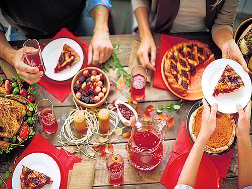 inviting MENU Apart from turkey, the specialities of a 'Thanksgiving' dinner include pies, mashed potatoes, peas and cranberry sauce.