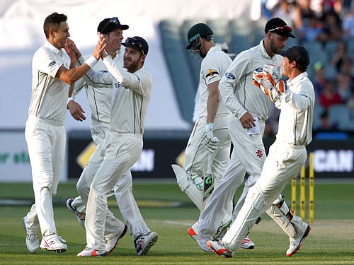 Australia's Adam Voges (C) walks off the ground after he was dismissed by New Zealand's Trent Boult (L) for 28 runs during the third day of the third cricket test match at the Adelaide Oval, in South Australia, November 29, 2015. REUTERS Photo
