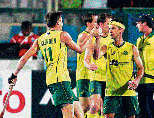 Australia's Eddie Ockenden (left) celebrates the team's semifinal win over the Netherlands with veteran Jamie Dwyer in Raipur on Friday.