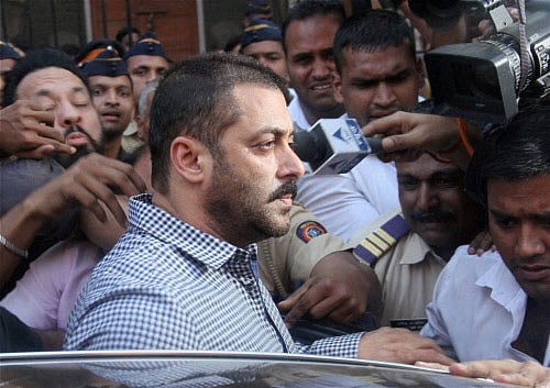 Actor Salman Khan leaves Bombay High Court after he was acquitted in 2002 Hit and Run case, in Mumbai on Thursday. PTI Photo