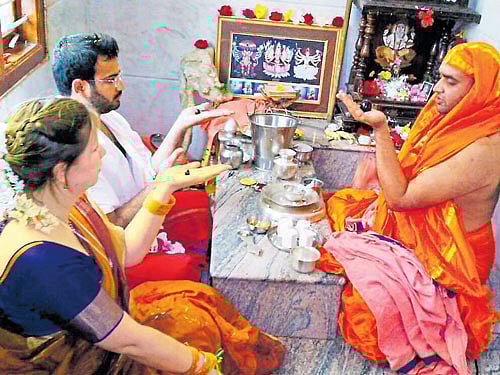 A German woman, Bayateko alias Biyaa, takes part in 'Linga Deekshe' along with her beau Madan at Chandravana, near Srirangapatna, Mandya district, on Wednesday. DH photo