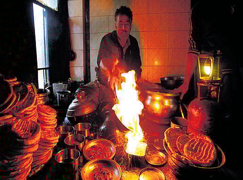 A man prepares Harissa in Srinagar. SHAHID TANTRAY