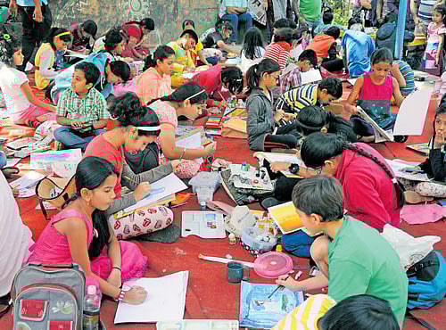 INTERESTING Youngsters taking part in the painting competition.