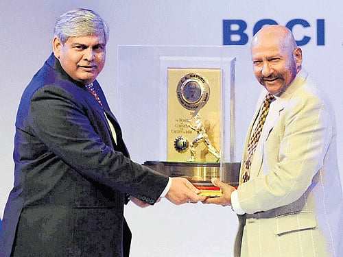 just reward BCCI President Shashank Manohar (left)  honours Syed Kirmani with Col CK Nayudu award. pti