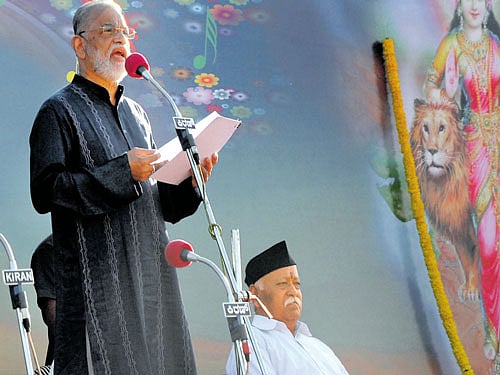 Dr K Radhakrishnan, former chairman of the Indian Space Research Organisation, speaks at the 'Swaranjali' event organised by the Rashtriya Swayamsevak Sangh (RSS) in Bengaluru on Sunday. Mohan Bhagwat, sarsanghchalak of the RSS, looks on.  PHOTO
