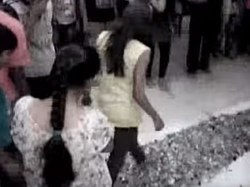 The incident took place on Tuesday when Rakesh Patel, a private tutor running coaching classes had asked about 70 young students and their parents to walk on broken glass shreds spread on the floor of his study centre. Video grab