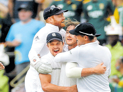 hit man England's Stuart Broad (centre) is mobbed by his team-mates after he dismissed South Africa's Stiaan van Zyl in the third Test on Saturday. reuters