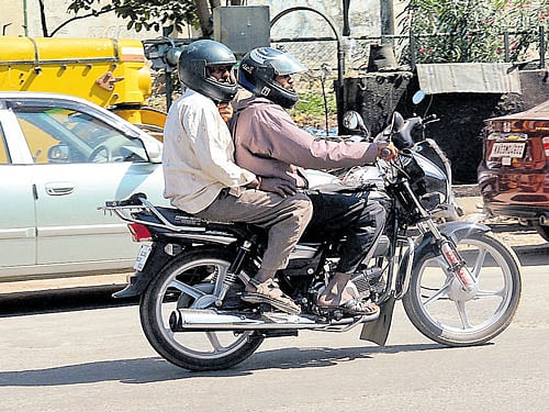 Bengaluru police started cracking the whip on helmetless pillion riders on Wednesday. DH photo