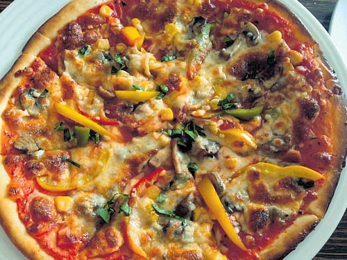 cheesy A wood fired thin crust pizza.