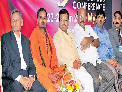 President of National Seva Doctors Association (NSDA)  Dr M S Shankar Naik, seer Somalinga Maharaj, Minister for Labour P T Parameshwar Naik, organising committee chairman Dr Umesh Jadhav, coordinator Dr D Ramanaik and  general secretary Dr Charan Jadhav during the inauguration of ninth NSDA&#8200;conference in Mysuru on Saturday. DH photo