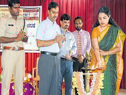 Zilla Panchayat Chief Executive Officer Priyanka Mary Francis inaugurates the National  Voters' Day programme in Udupi on Monday. Superintendent of Police Annamalai (left) and Deputy Commissioner Dr Vishal R (second left) look on. DH photo
