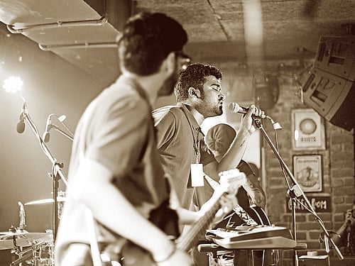 in sync Arjun and Rajiv performing on stage.
