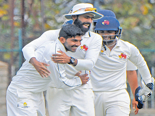 man of the moment Mumbai's Akhil Herwadkar (left)  celebrates with team-mates after dismissing Saurabh Tiwary of Jharkhand in Mysuru on Thursday. DH photo/ Prashanth HG