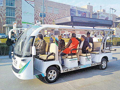 The driverless shuttle ferries visitors between pavilions, at the Auto Expo in Greater Noida, on Sunday.