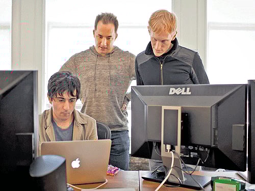 A file photo of Arash Ferdowsi, co-founder of Dropbox, Drew Houston, chief executive, and Jeff Bartelma, director of products, at the company's office in San Francisco. INYT