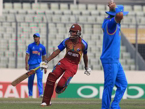 West Indies cricket player Keacy Carty, center, celebrates after defeating India during their ICC Under 19 Cricket World Cup final match in Mirpur, outskirts of Dhaka, Bangladesh, Sunday, Feb. 14, 2016. AP/PTI