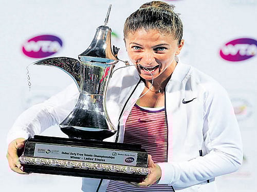 ECSTATIC Sara Errani of Italy poses with her Dubai Open trophy on Saturday. Reuters