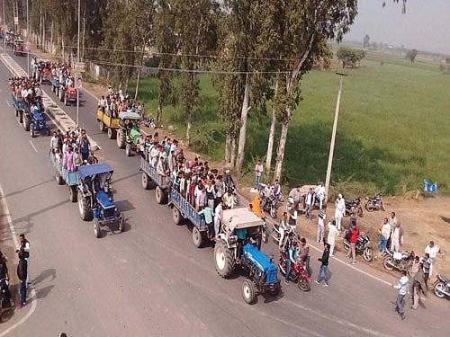 Members of the Jat community take to streets in large numbers as the Jat agitation for reservation intensifies in Sonipat on Saturday. PTI Photo