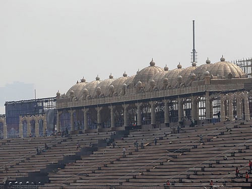 Workers lay carpet on the steps of a stage at the venue of World Culture Festival on the banks of the river Yamuna in New Delhi, India, March 8, 2016. Indian environmentalists are aghast at the hosting of a huge cultural festival on the floodplain of Delhi's main river that begins on Friday, warning that the event and its 3.5 million visitors will devastate the area's biodiversity. Picture taken March 8, 2016. REUTERS