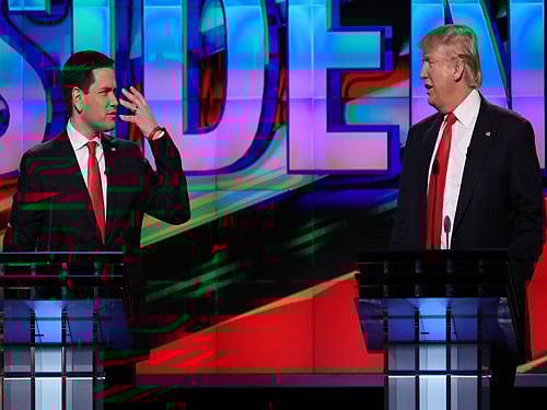 Republican U.S. presidential candidates Donald Trump (R) and Marco Rubio talk at each other during a debate sponsored by CNN at the University of Miami in Miami, Florida. Reuters Photo.