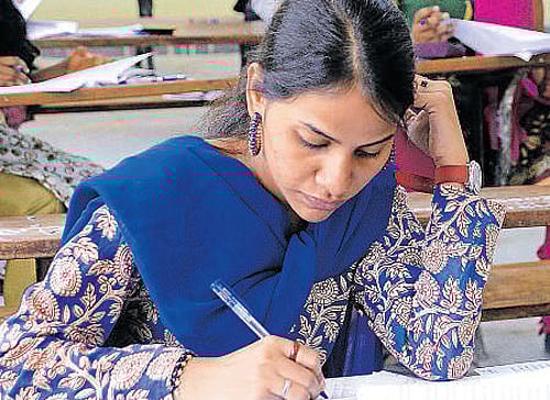 Students writing the  examination on Friday.  dh photo