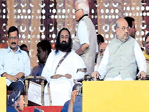 Arvind Kejriwal, Sri Sri Ravi Shankar and Amit Shah at the AoL festival. DH photo