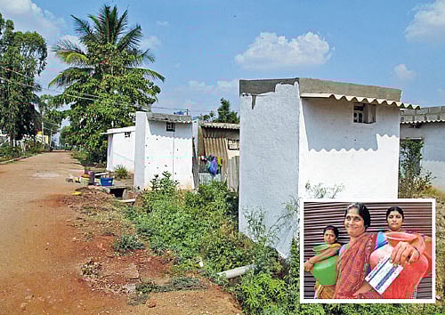 For quality life: Some of the toilets built in Hennagara; (inset) women at the local water supply centre.