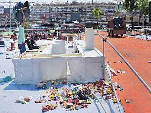The stage littered with wrappers and paper strips. DH photo