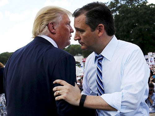 File photo of U.S. Senator Cruz greeting Trump onstage as they address a Tea Party rally at the U.S. Capitol in Washington. Reuters