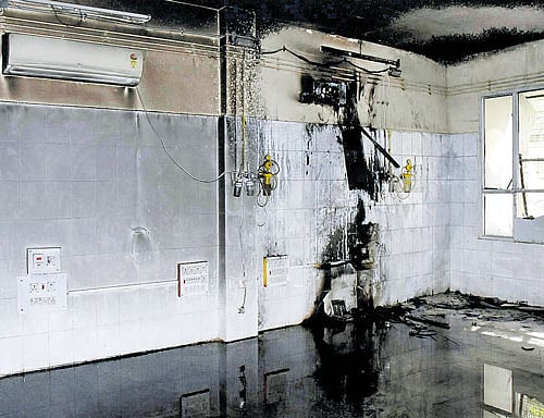 Air conditioners were charred at the neonatal critical care unit of the district general hospital after a fire broke out on Wednesday in Kalaburagi:. DH Photo