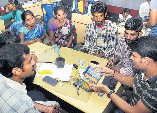 Researchers and waste-pickers deliberate on easier, safer means to dispose of garbage at a hackathon on IISc campus in the city on Saturday. dh photo