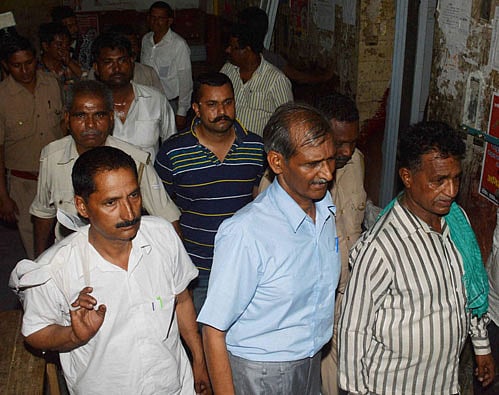 convicts policemen being taken to Lucknow jail, after a special CBI court sentenced 47 policemen to life imprisonment for killing 10 Sikh pilgrims in a fake encounter 25 years ago, in Pilibhit on Monday. PTI Photo